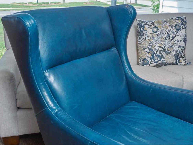 Pair Of 'Peacock Blue' Leather Wing Back Chairs