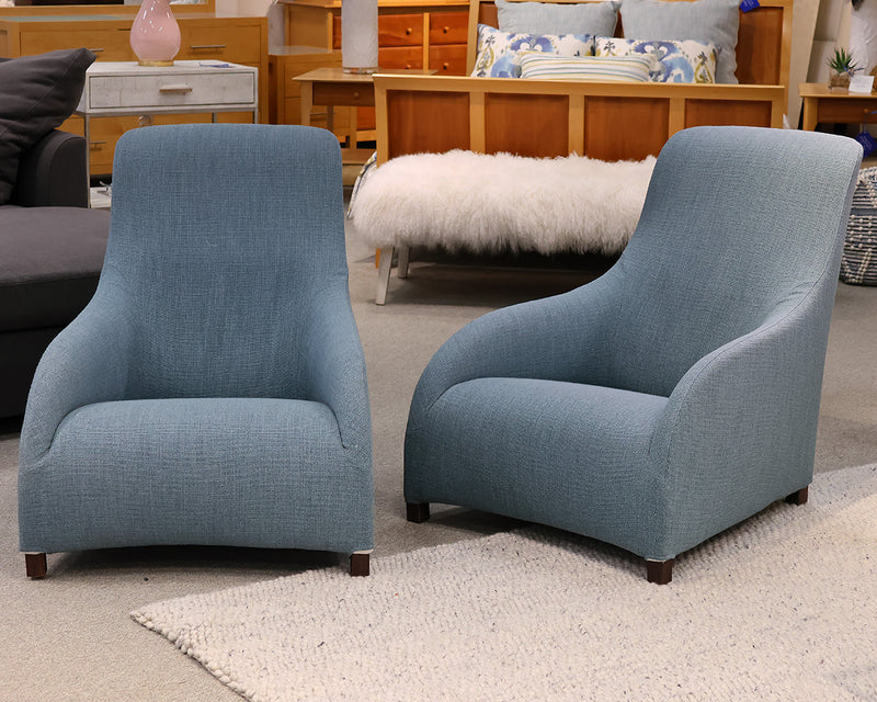 Accent Chairs Contemporary accent chairs in a blue woven fabric.